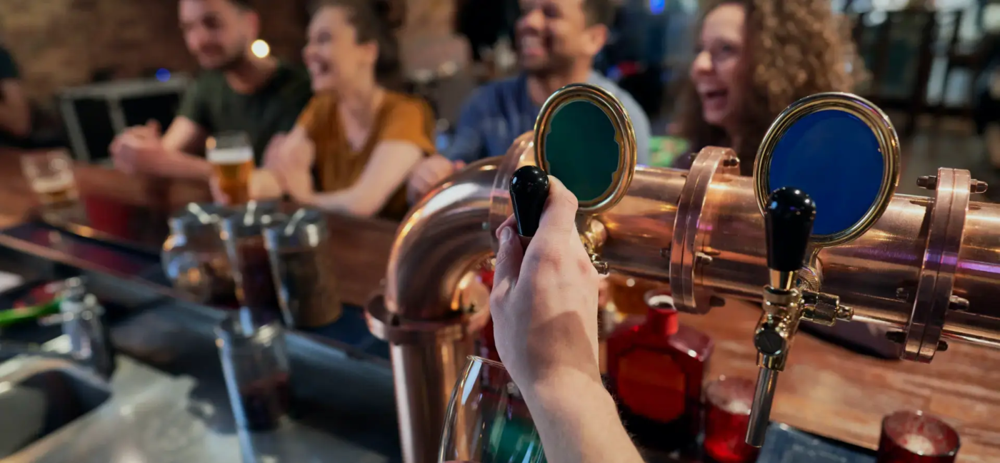 close-up-of-bartender-serving-beer-at-bar-2026-03-13-05-34-27-utc copy